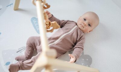 baby playing with parent